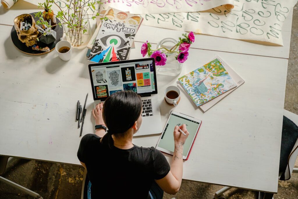 C2C - Building The Best Consumer Communities! Photo of Woman Writing on Tablet Computer While Using Laptop
